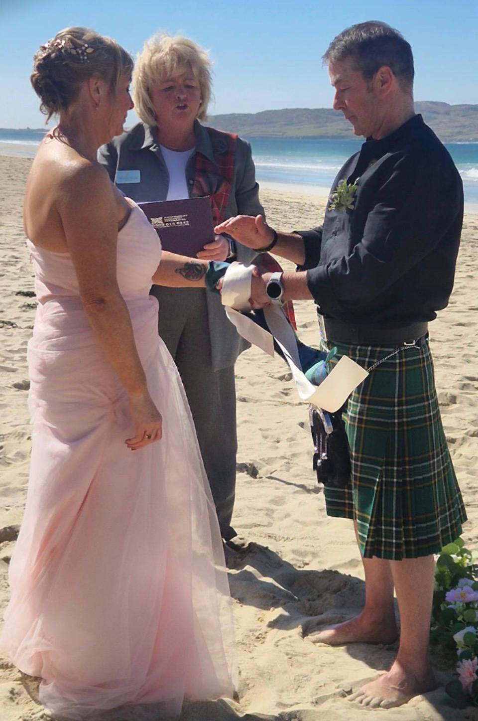 Victoria leading a wedding ceremony on a Scottish beach